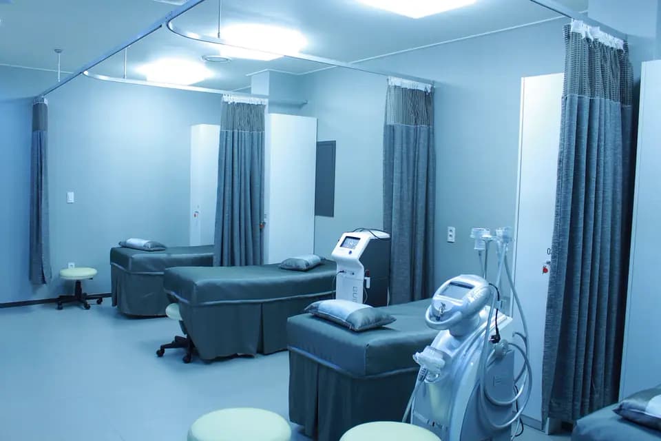 A modern hospital ward with beds and equipment