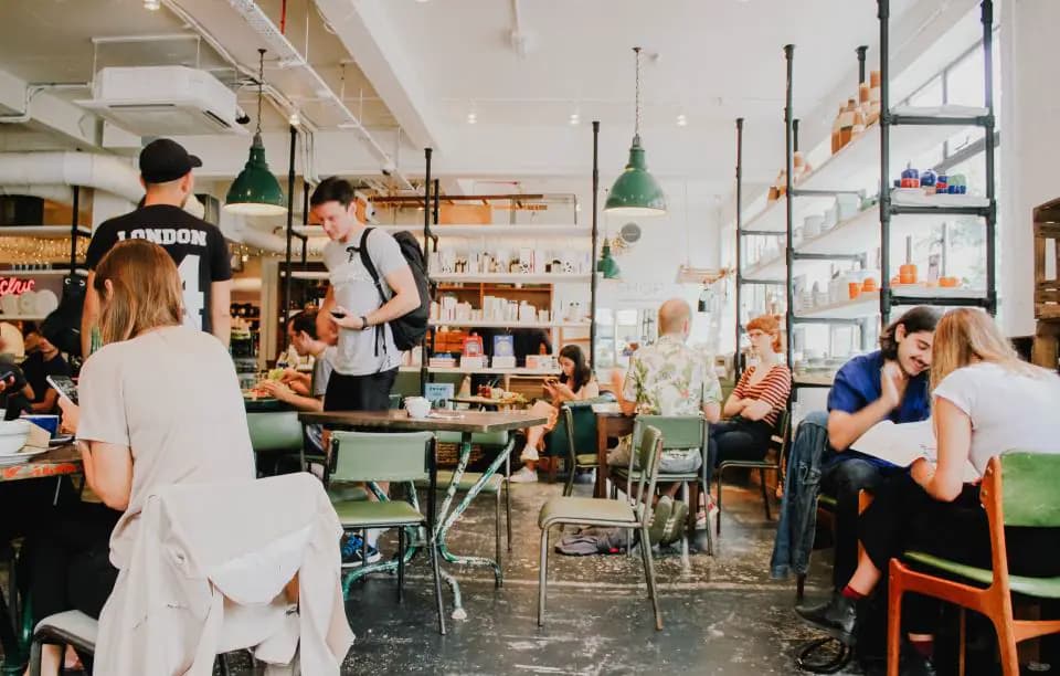 Guests dining in a busy, bright café